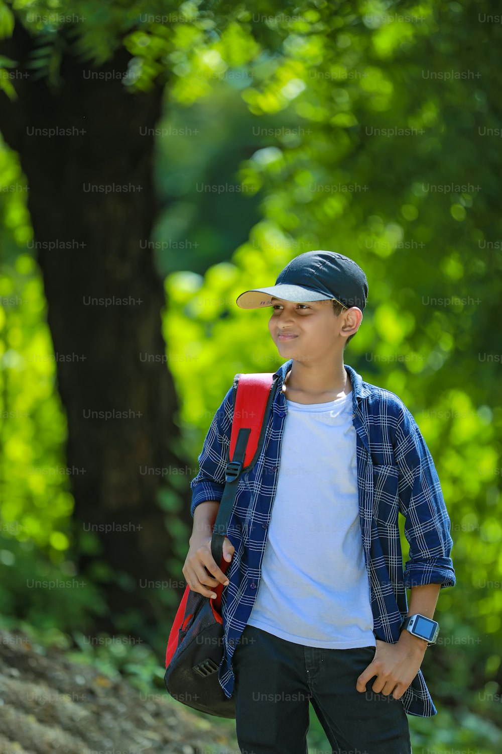 Indian cute schoolboy with backpack, Back to school concept