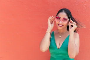 Portrait Of A Smiling Beautiful Woman Wearing Sunglasses