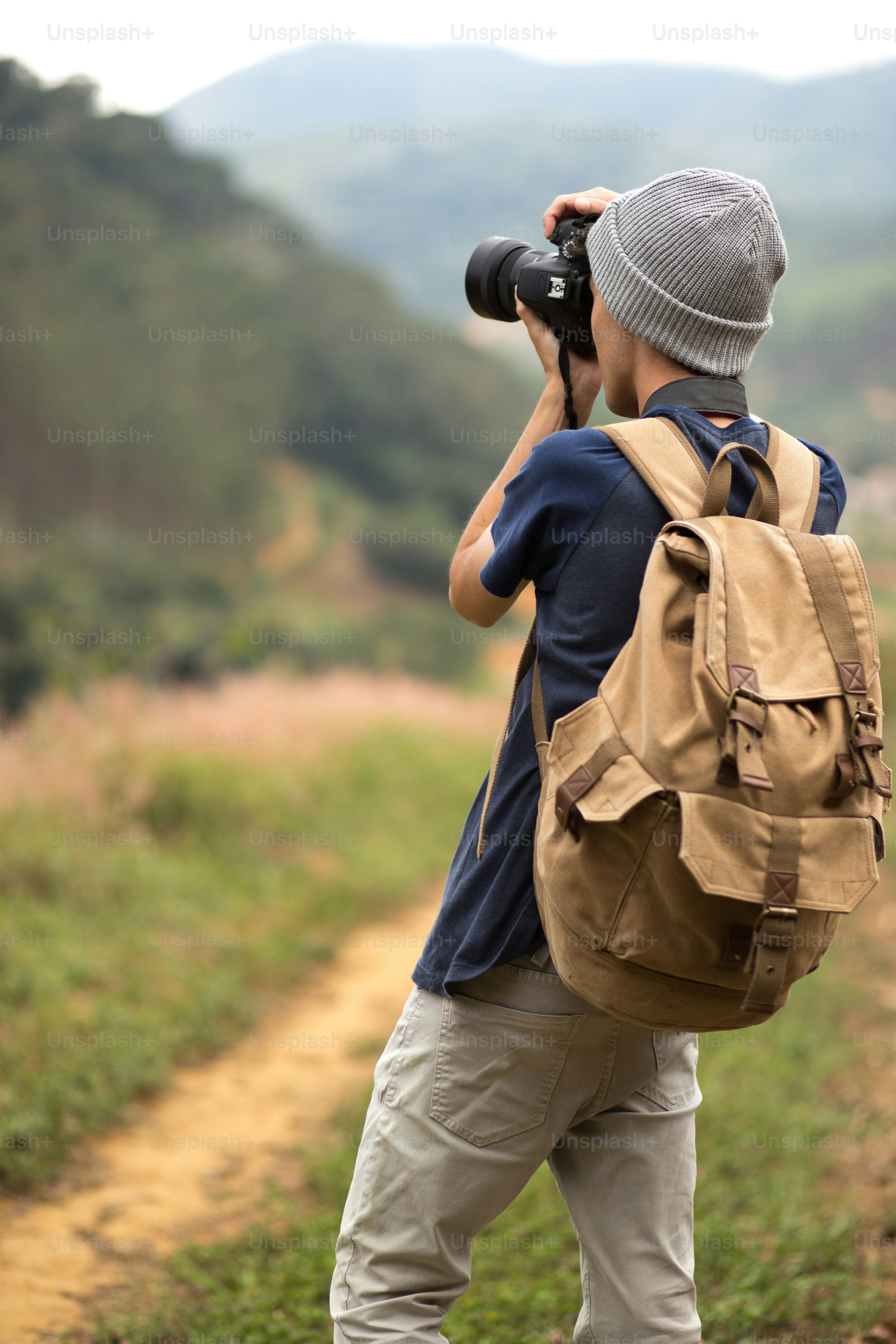 young photographer with his camera taking pictures