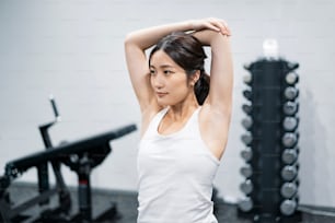 Asian young woman training in the gym