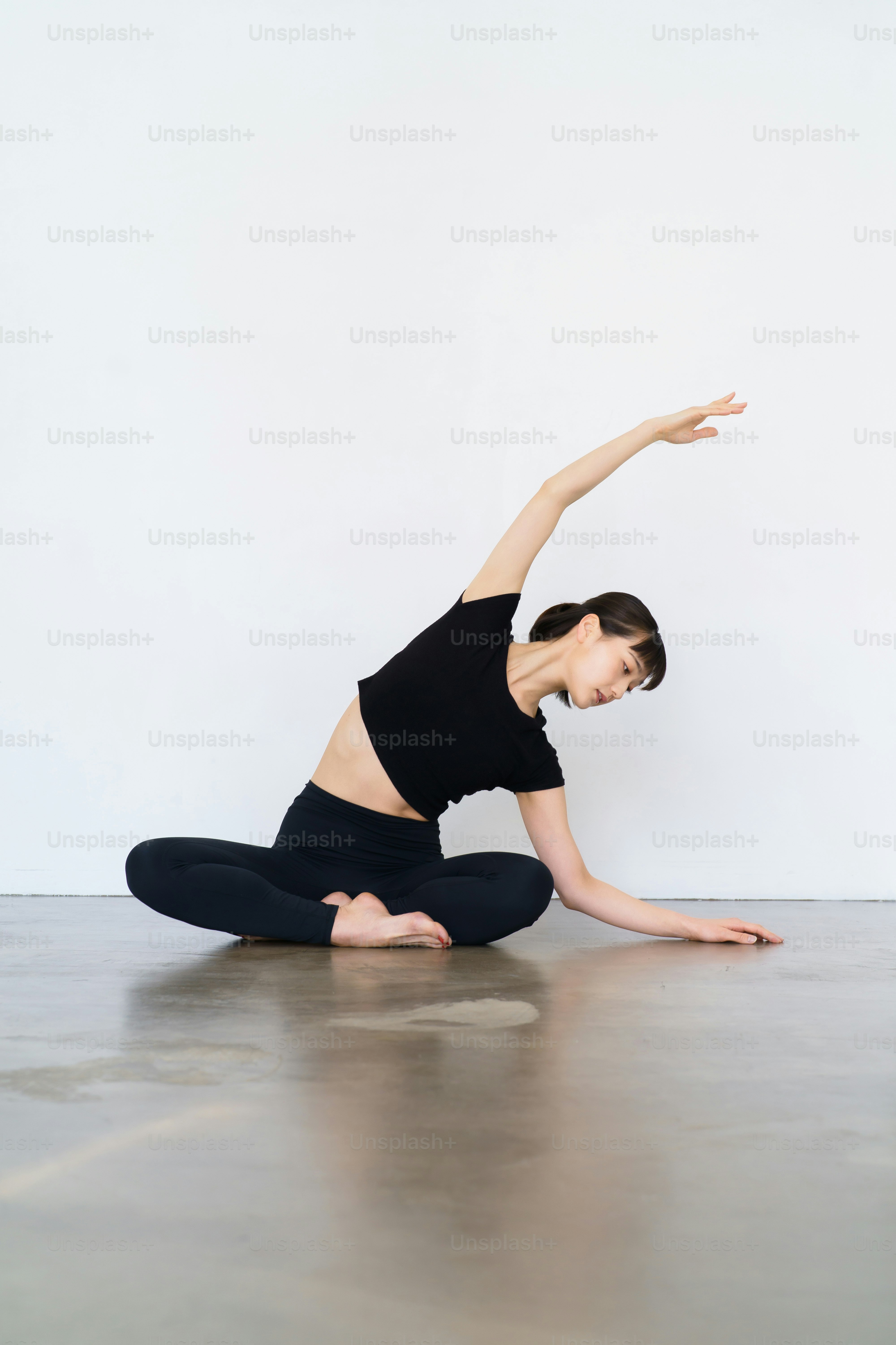 Young woman doing yoga and flexible exercise indoors