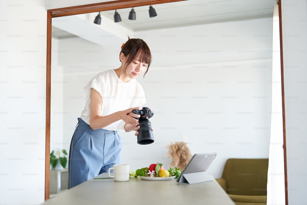 Female photographer checking the photos he took on a monitor