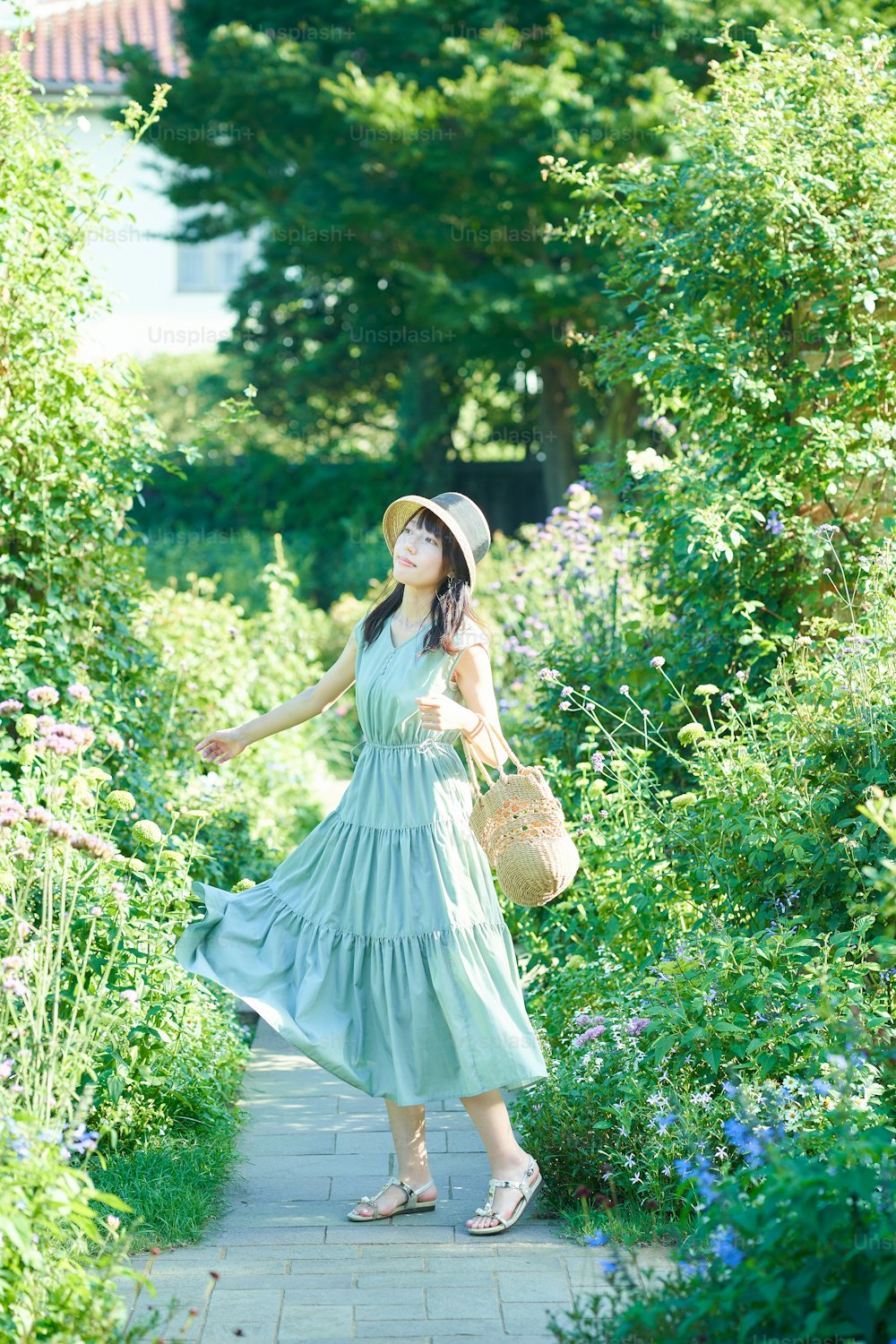 young woman walking in green on fine day