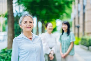 Asian gray-haired woman portrait outdoors