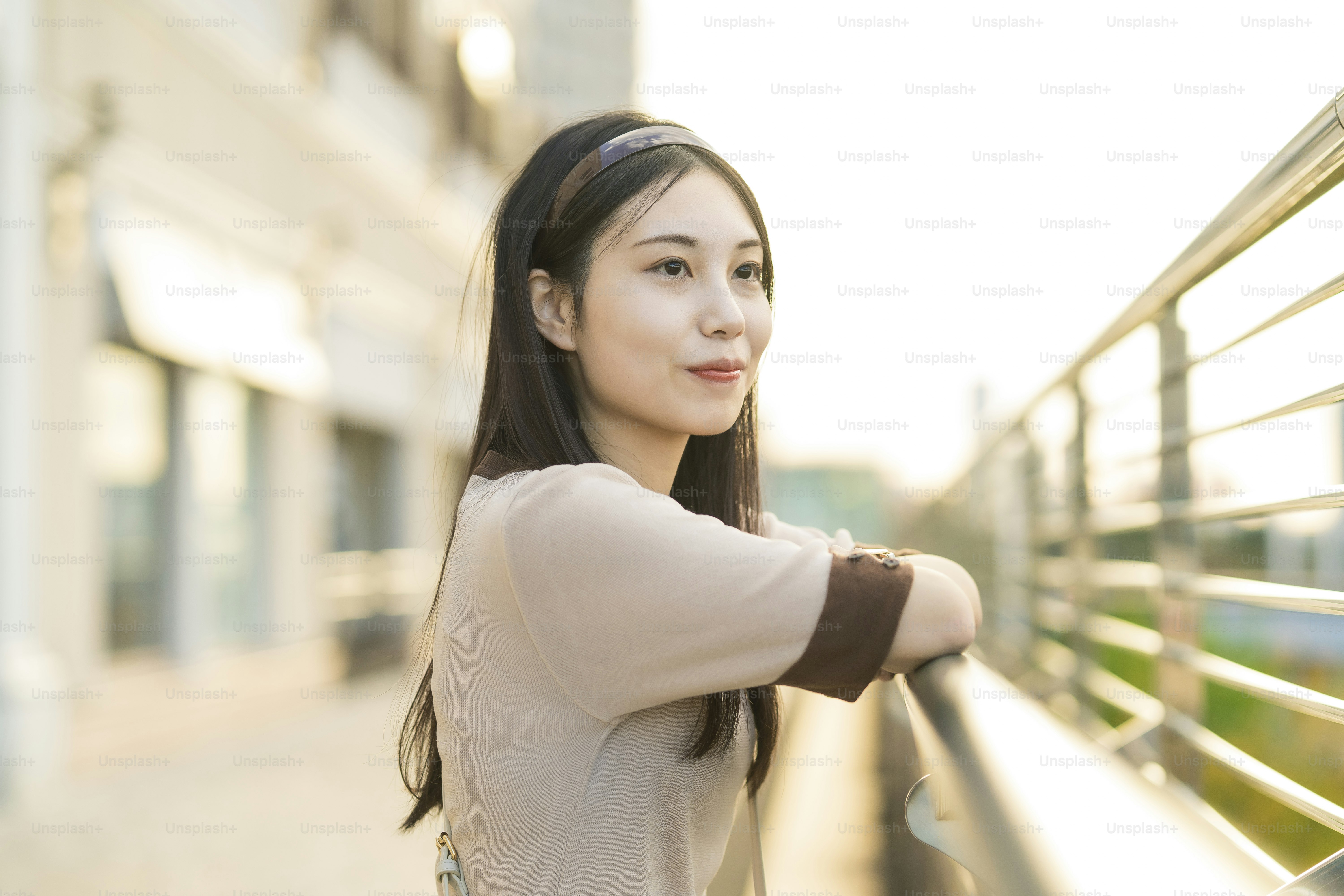 Outdoor portrait of a young Asian woman with black long hair photo ...