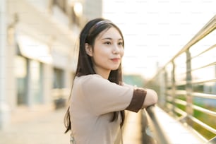 Outdoor portrait of a young Asian woman with black long hair