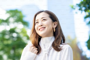 Outdoor portrait of smiling woman on fine day