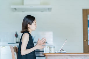 A woman who communicates online using a tablet PC