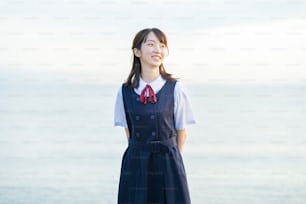 High school girl showing a smile and the background of the sea