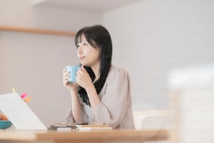 A woman taking a break while working from home