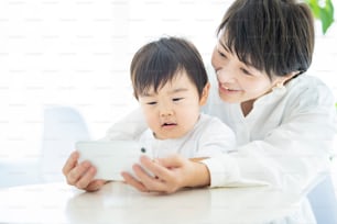 Child and mom crazy about smartphone screen