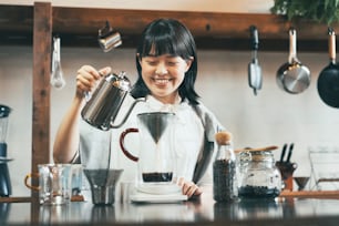 A young woman brewing coffee in a relaxing space