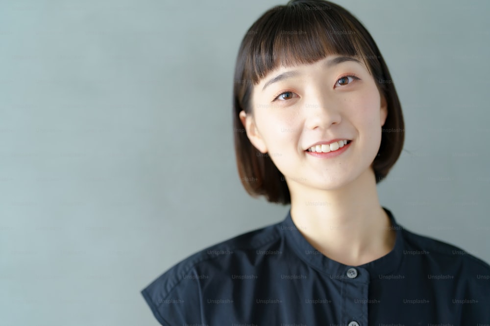 Portrait of a smiling young woman indoors