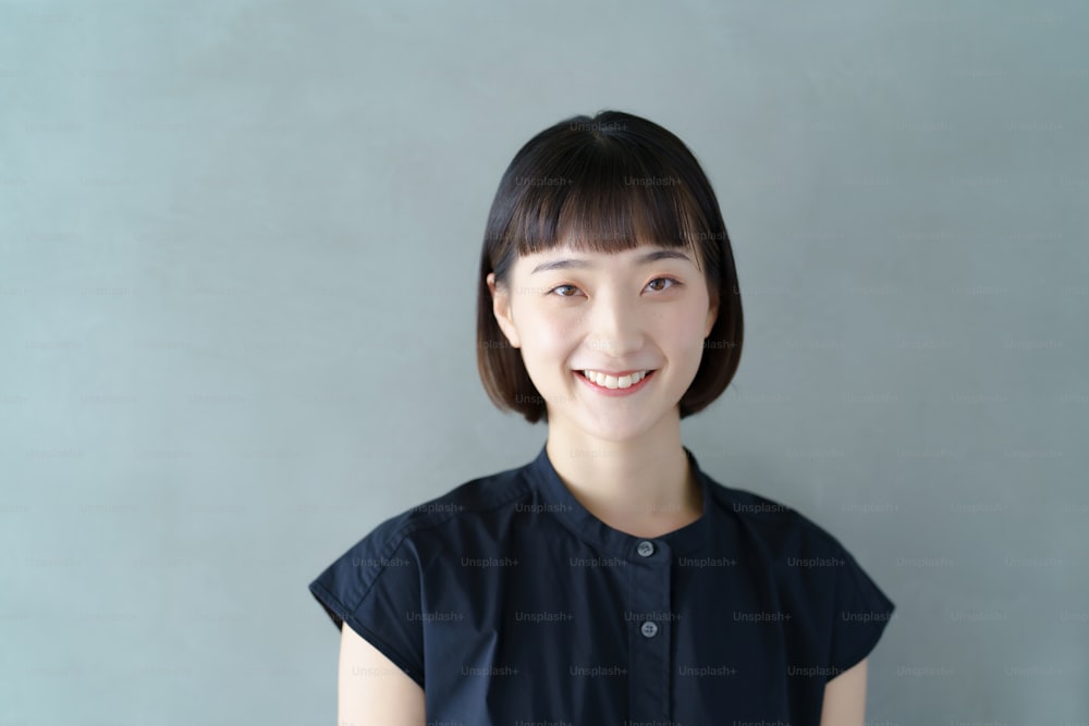 Portrait of a smiling young woman indoors