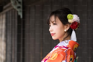 Young asian girl wearing kimono (Japanese traditional clothes).