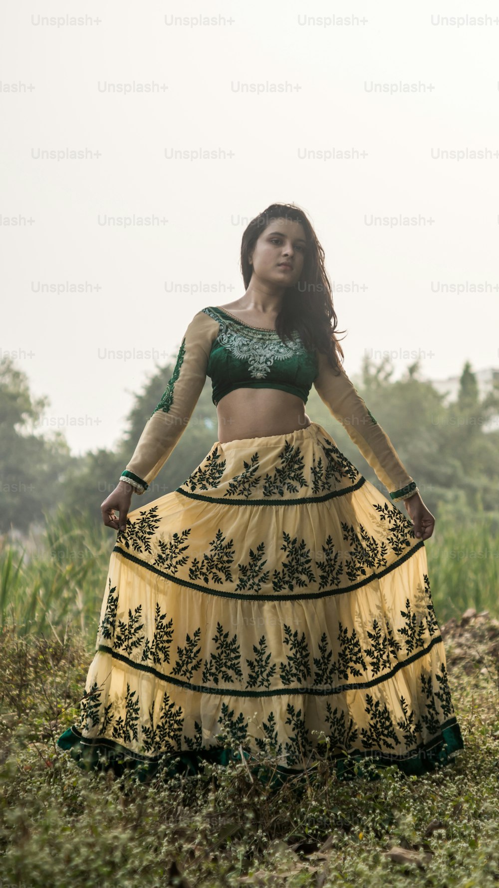 Portrait of beautiful Indian girl. Young hindu woman in traditional Indian costume lehenga choli or sari or saree