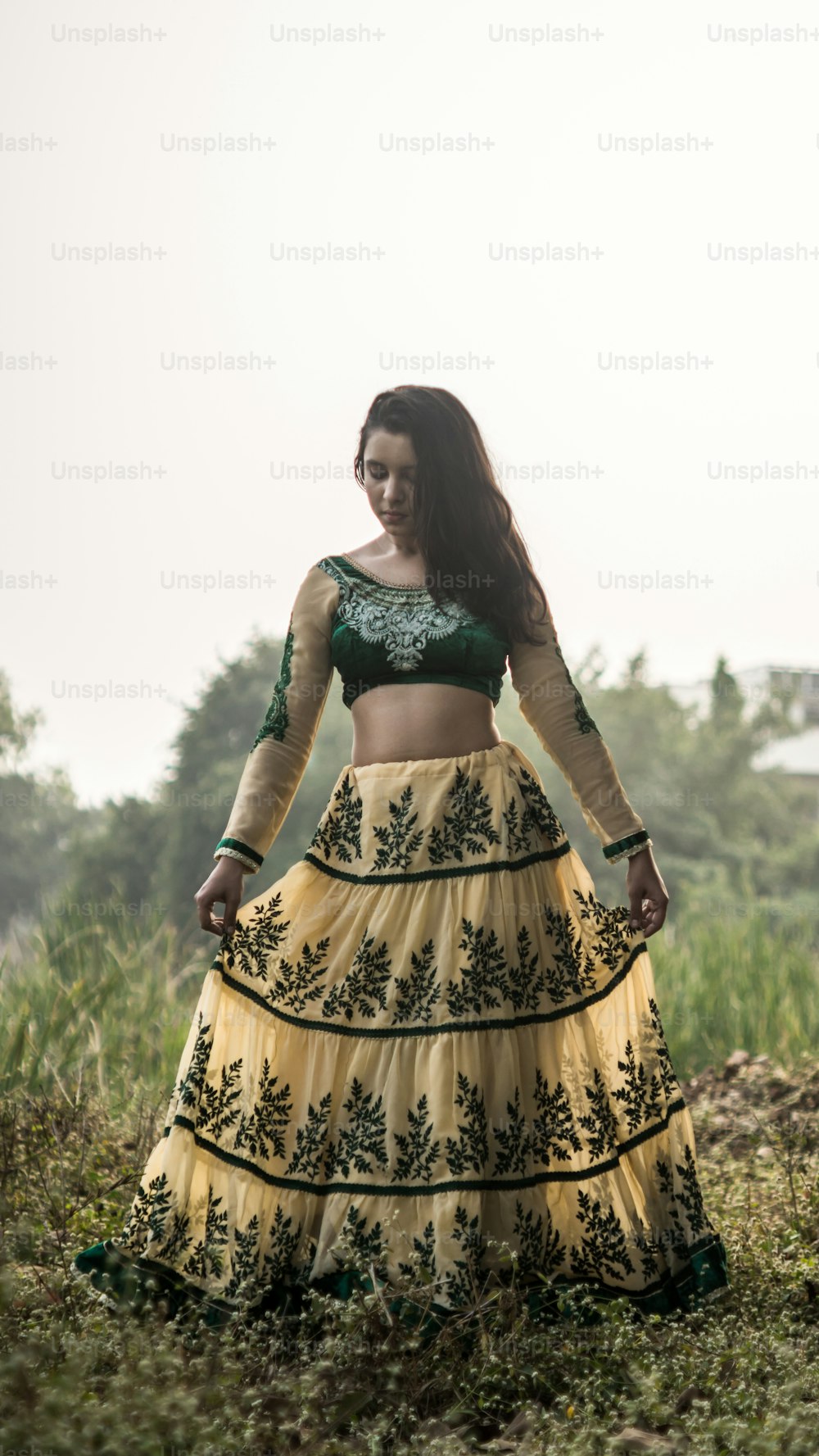 Portrait of beautiful Indian girl. Young hindu woman in traditional Indian costume lehenga choli or sari or saree