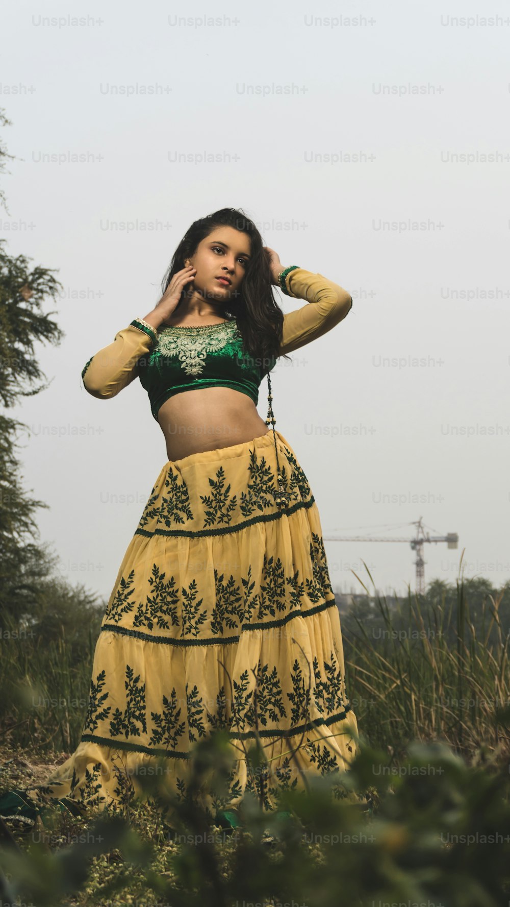 Portrait of beautiful Indian girl. Young hindu woman in traditional Indian costume lehenga choli or sari or saree