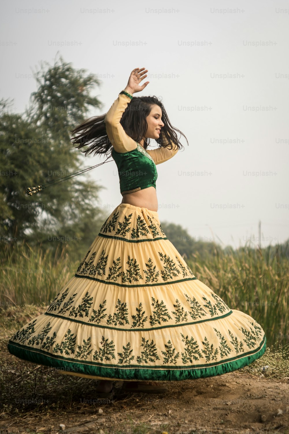 Portrait of beautiful Indian girl. Young hindu woman in traditional Indian costume lehenga choli or sari or saree