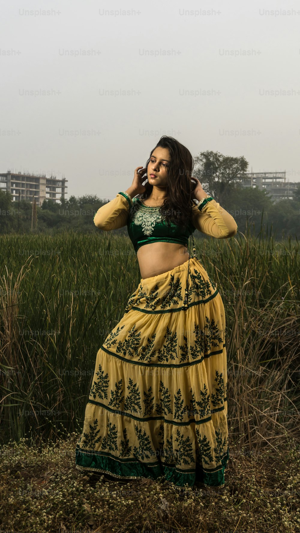 Portrait of beautiful Indian girl. Young hindu woman in traditional Indian costume lehenga choli or sari or saree