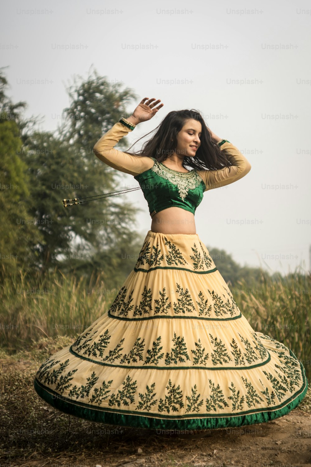 Portrait of beautiful Indian girl. Young hindu woman in traditional Indian costume lehenga choli or sari or saree