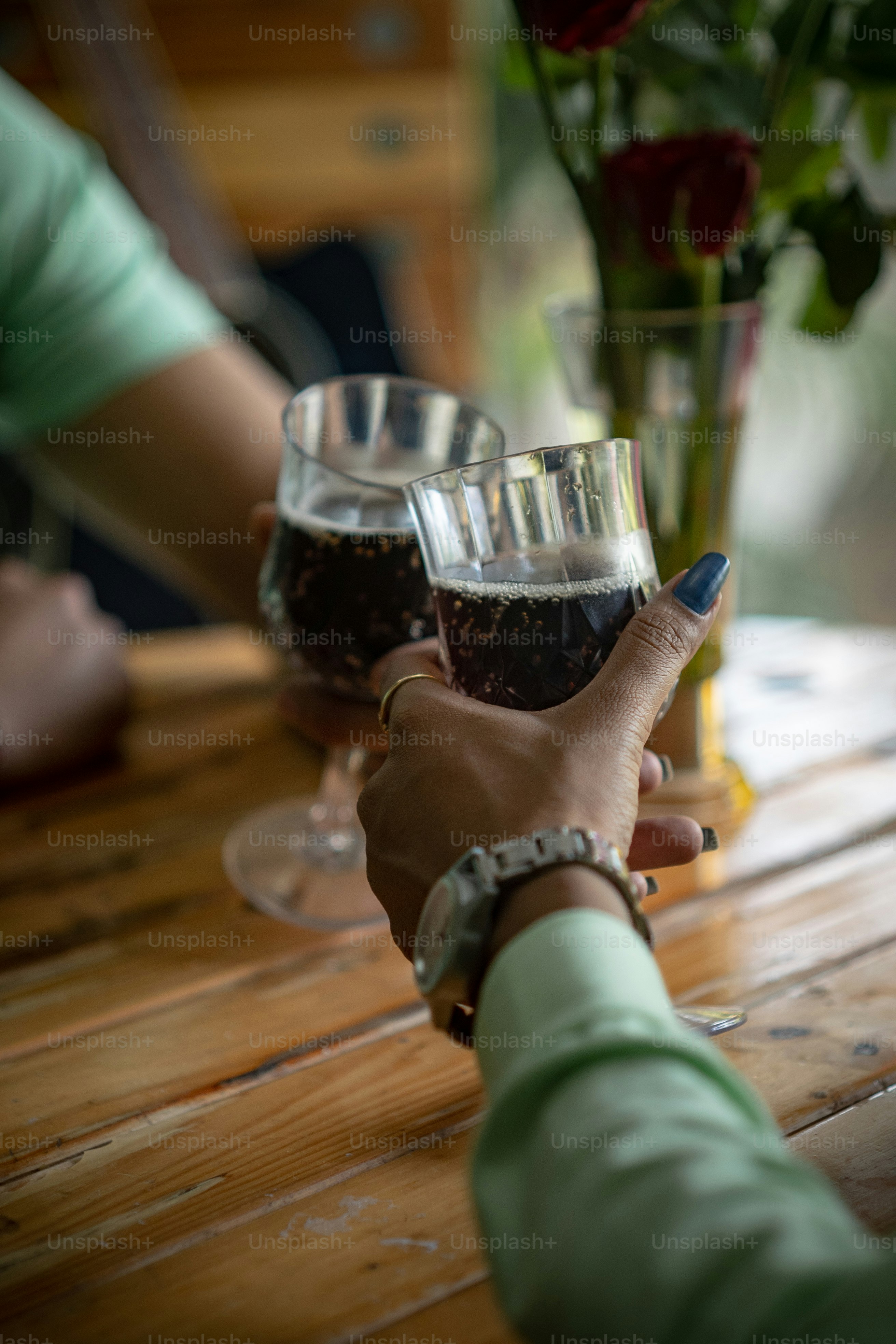 Young man and woman enjoying of Cheers glass of drink. Two people celebrating new year with drinks