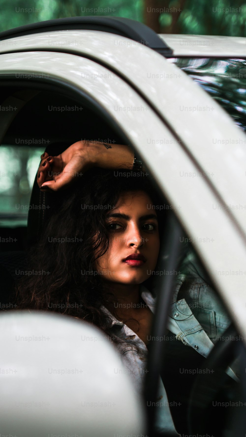 Adult young bold female model in car