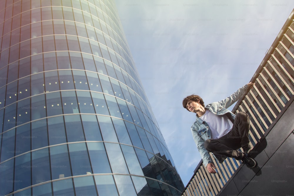 Young man doing parkour in the city