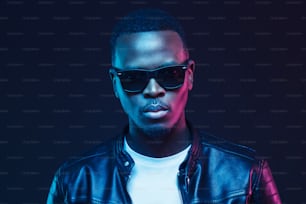 Close-up portrait of stylish black man, wearing leather jacket and sunglasses