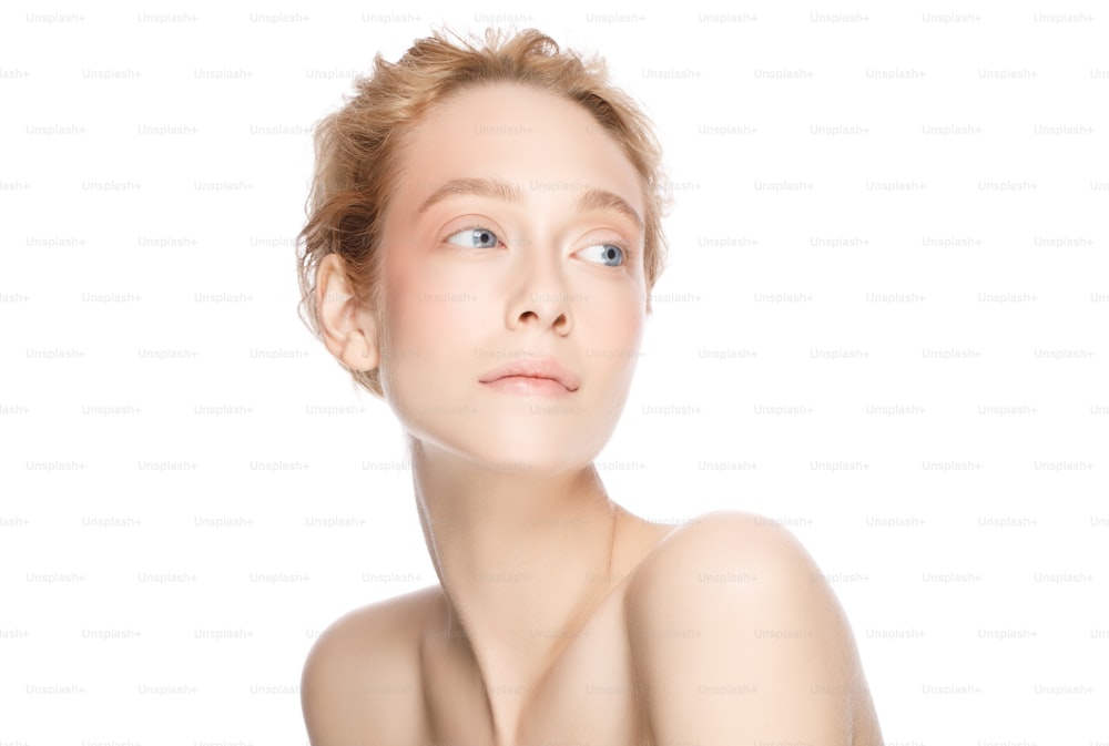 Young elegant beautiful woman with blond hair, blue eyes and long neck, posing with naked shoulders, looking aside, isolated on white background