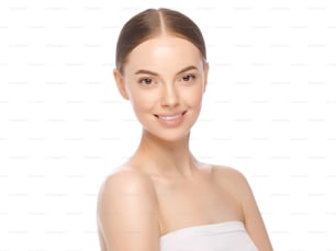 Portrait of young beautiful woman standing with naked shoulders and perfect clean skin, isolated on white background