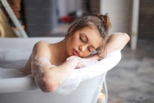 napping girl in the bathroom.rest for soul and spirit. exhaustion after working days