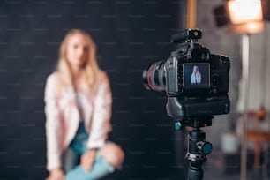 camera screen focusing the face of attractive model, close up photo. blurred background