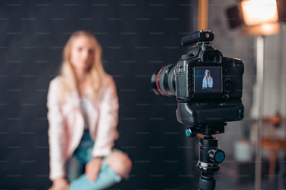 camera screen focusing the face of attractive model, close up photo. blurred background