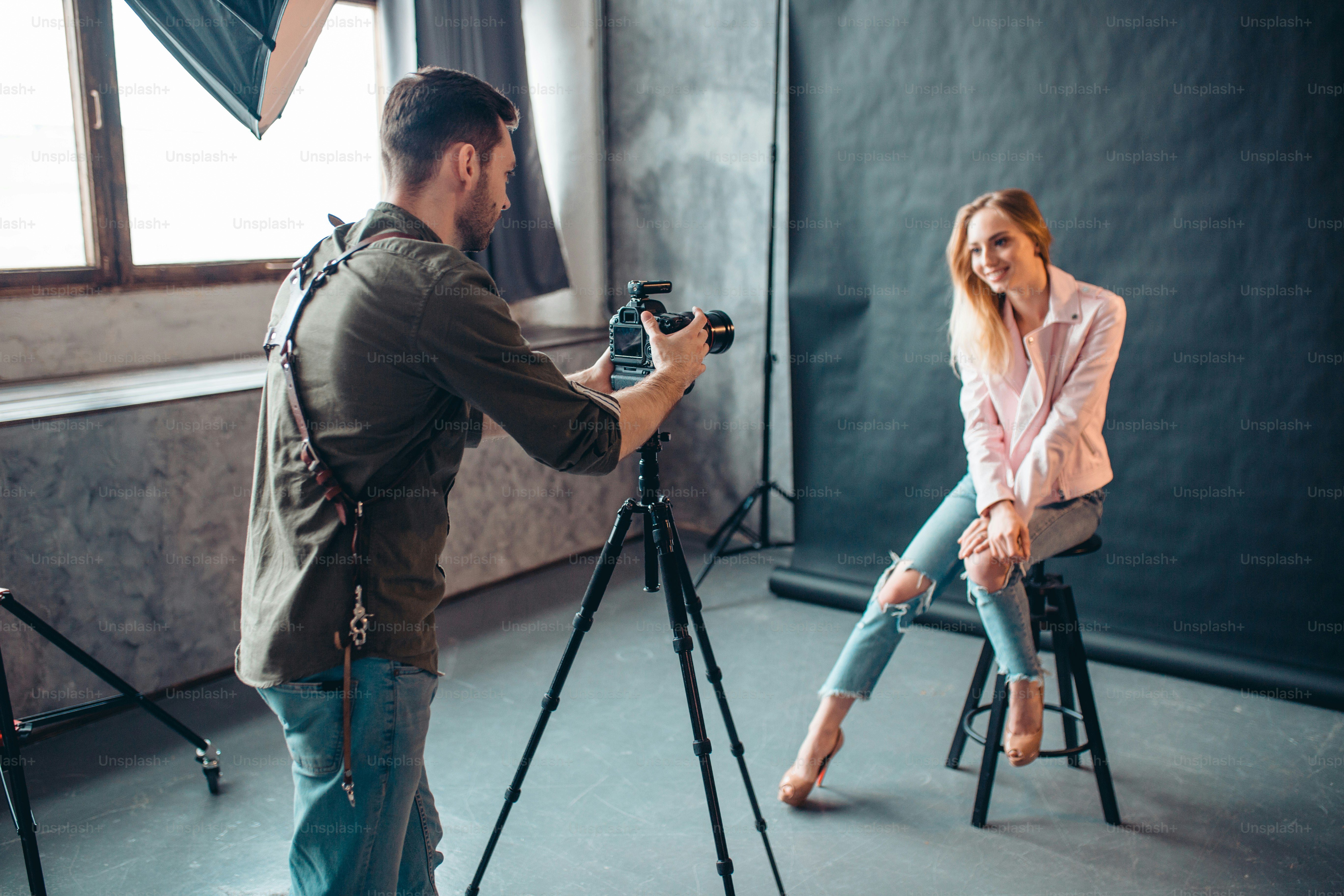happy girl is shooting a video for her boyfriend on his birthday, unusual congratulation