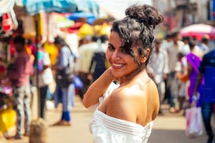 indian wearing fashionable clothes posing in asian bazar .