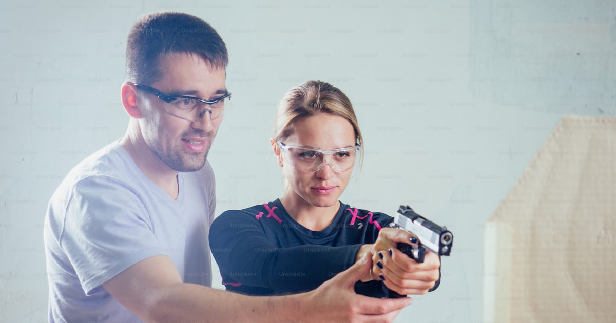 A person target practicing with a handgun for self defense. photo ...