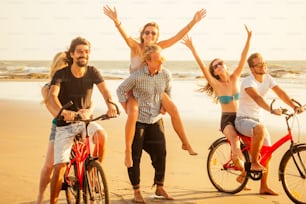 six friends meeting on the beach in Goa India and having time together .