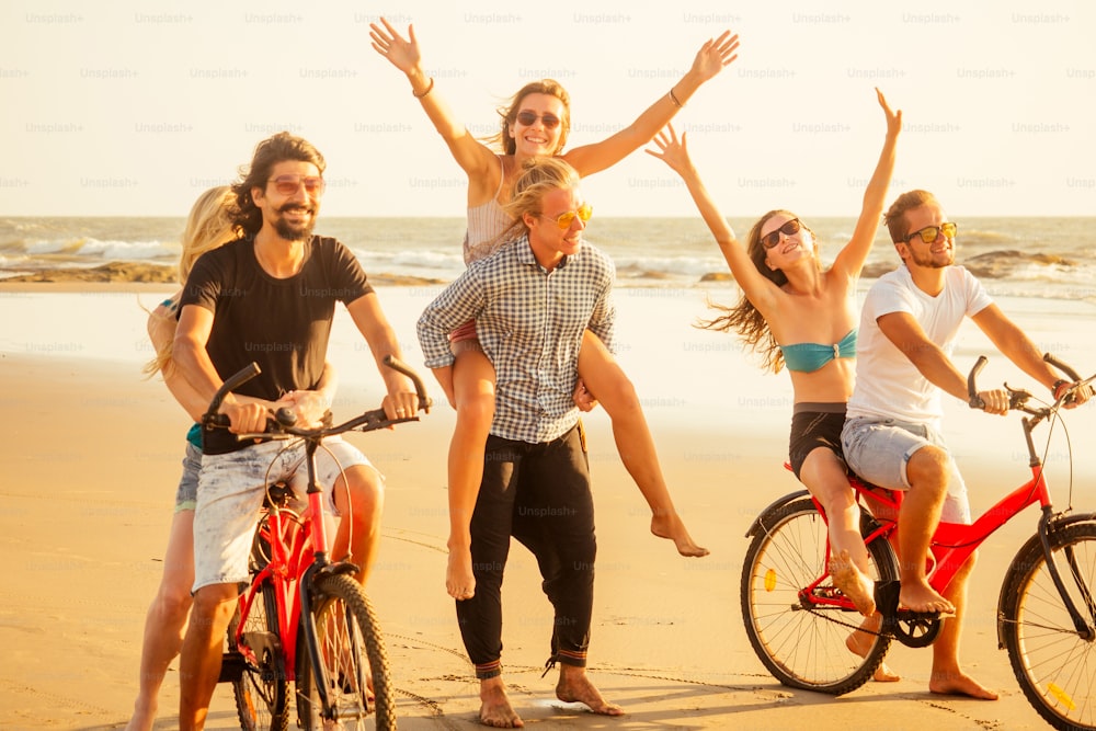 six friends meeting on the beach in Goa India and having time together .