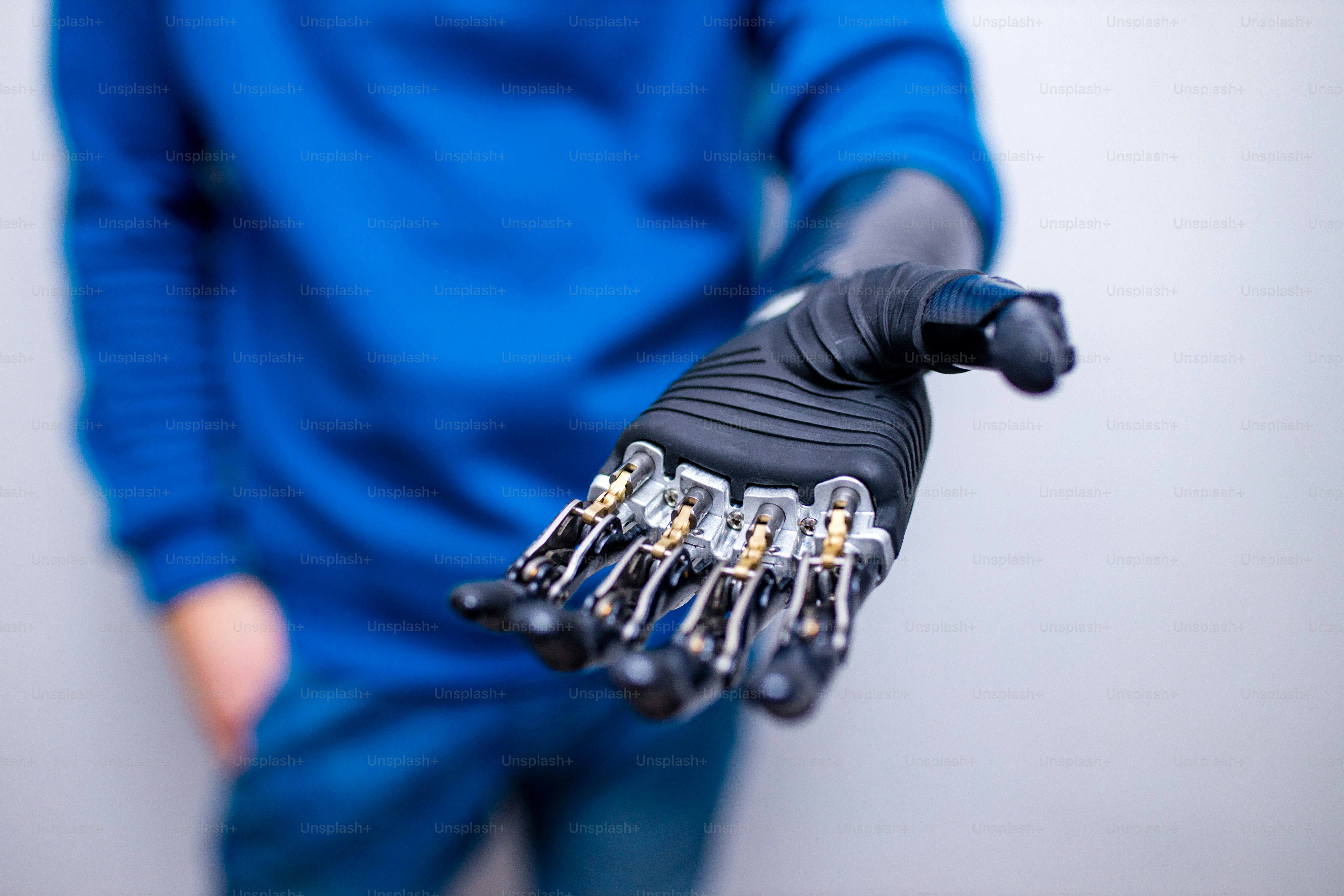 young man with modern biotechnology hand in apartment.