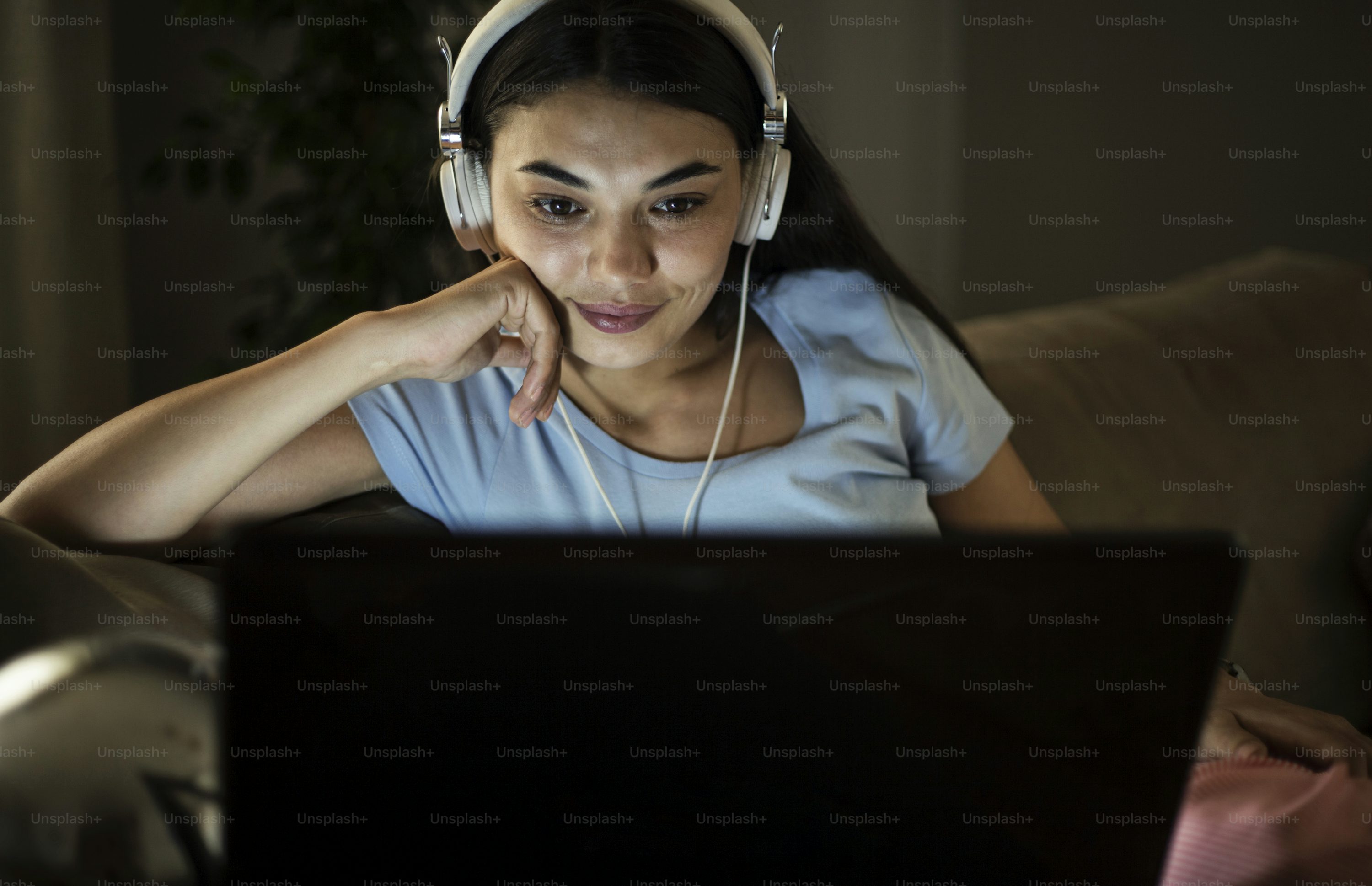 Person watching TV at night