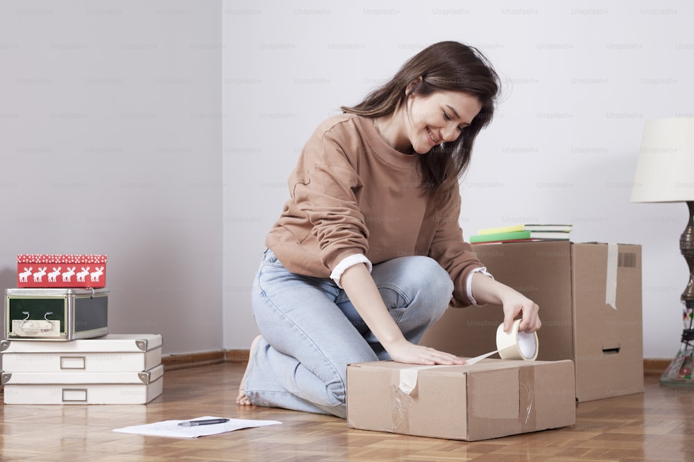 woman moving into new home with boxes