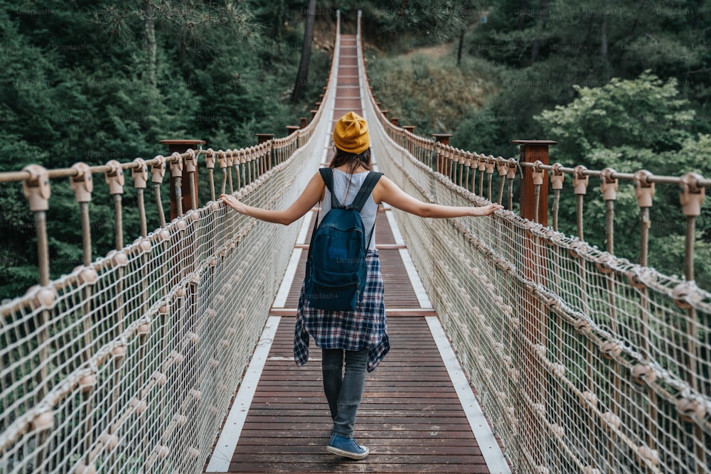 Happy travel woman on vacation concept. Funny traveler enjoy her trip and ready to adventureHappy travel woman on vacation concept. Funny traveler enjoy her trip and ready to adventure