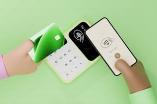 eine Hand, die eine Kreditkarte neben einem Handy hält