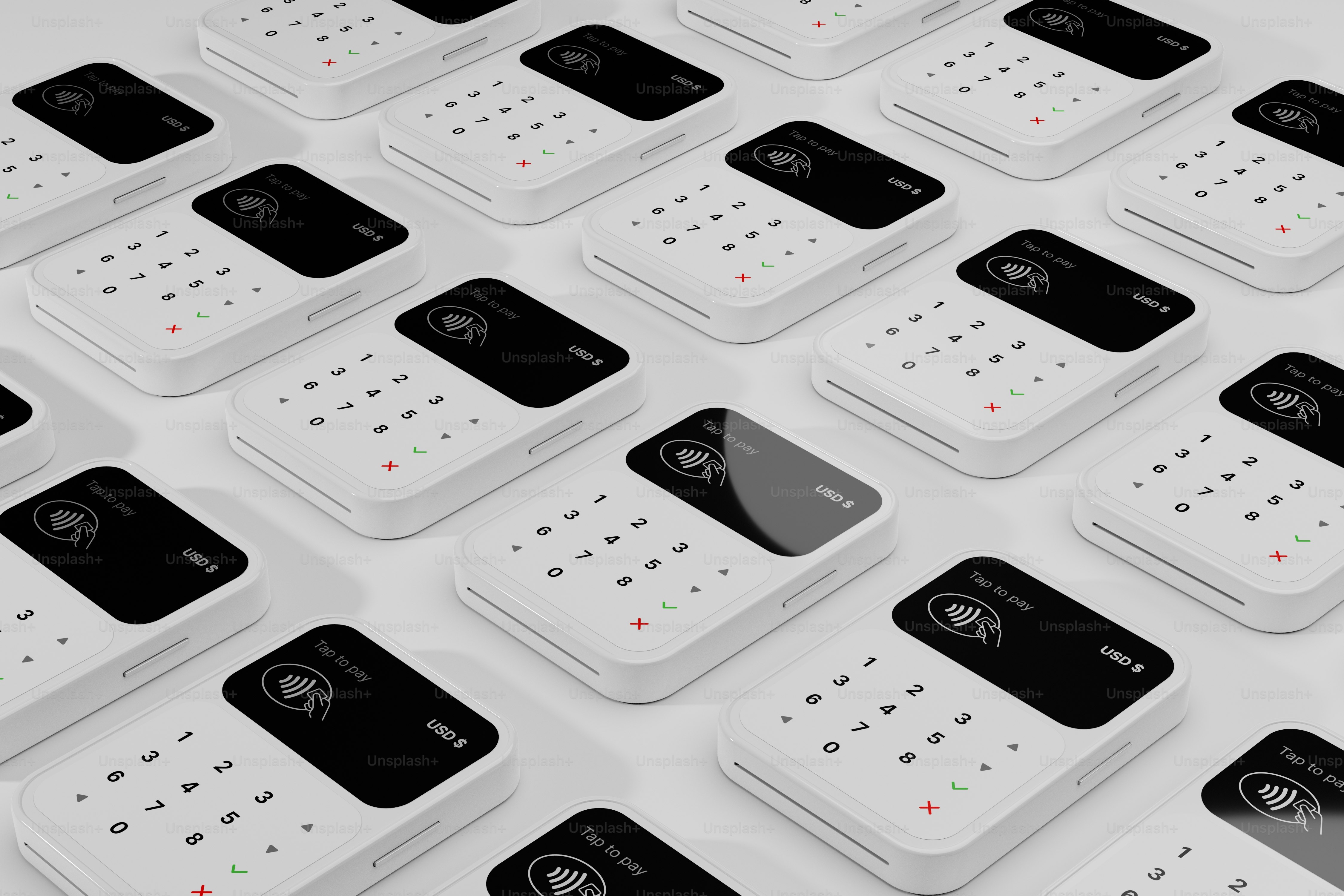 a group of white and black remotes sitting on top of each other