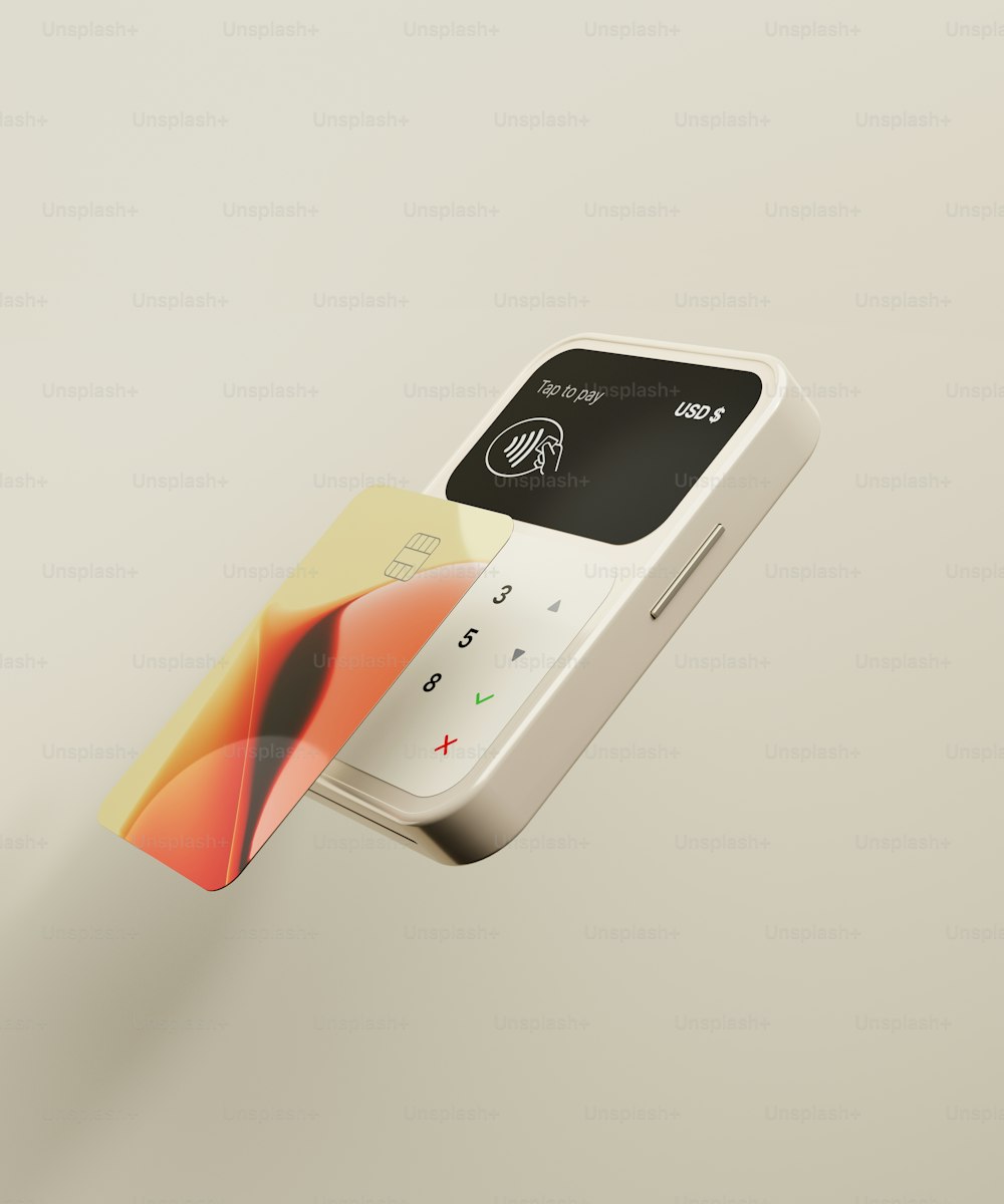 un primo piano di un telefono cellulare con una carta di credito collegata ad esso