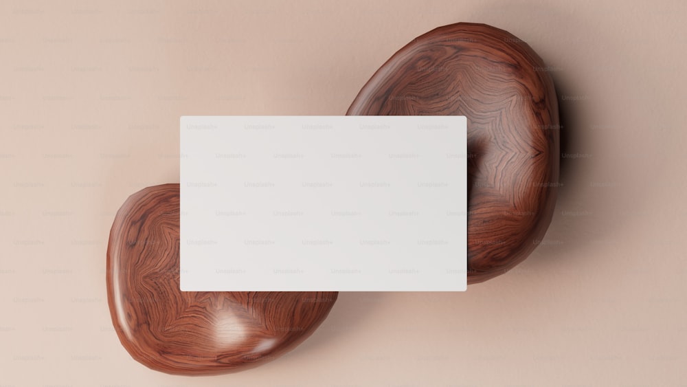 a wooden object with a white card on it