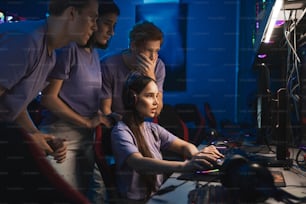 Players of the e sports team gathered together in the computer club and watching the stream from the world gamers championship