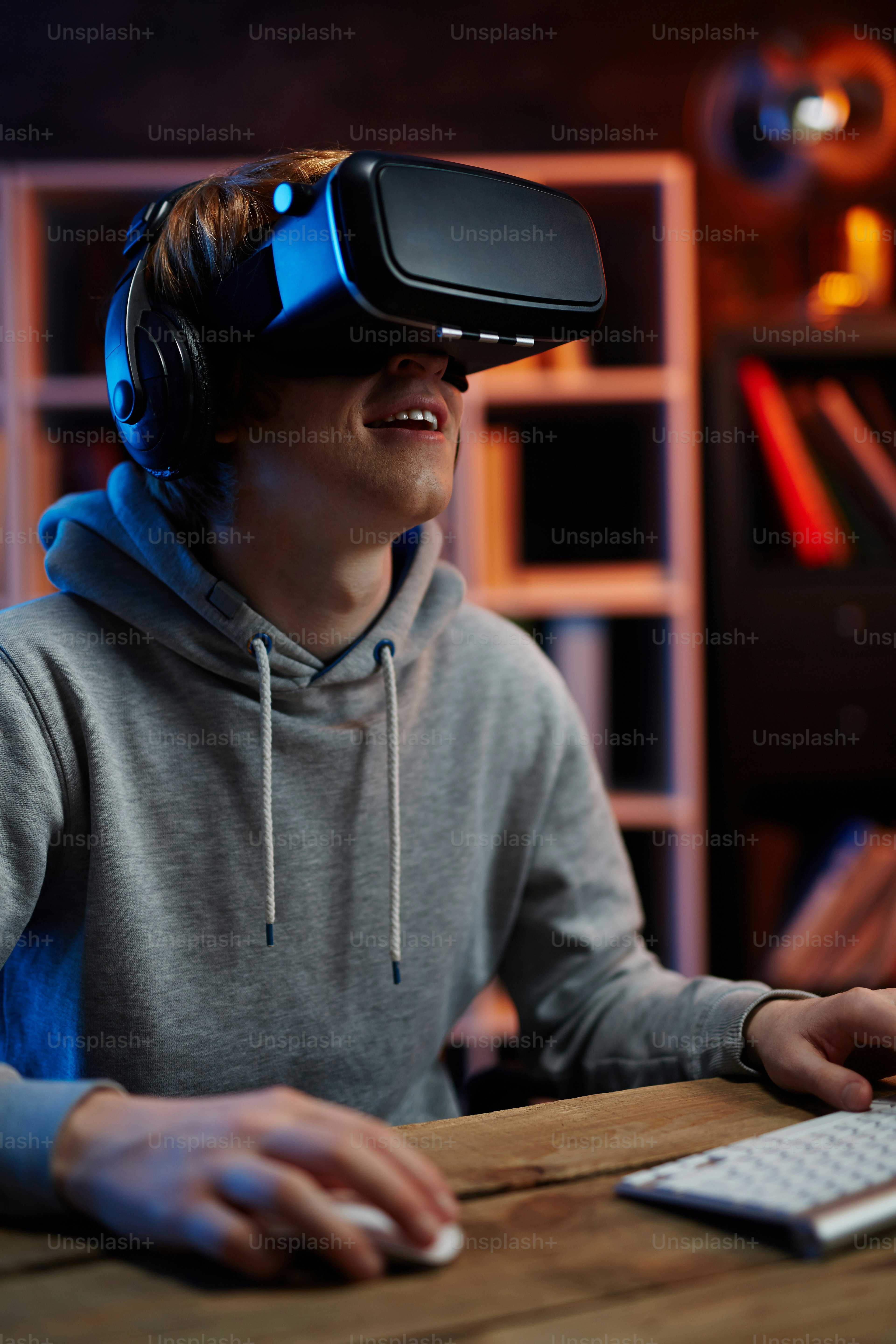Excited guy in virtual reality headset enjoying video game
