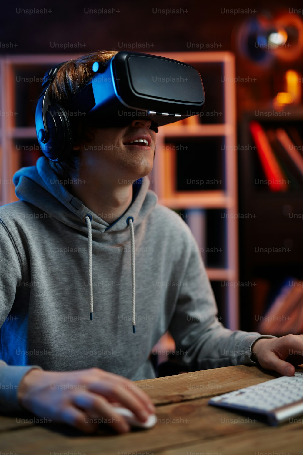 Excited guy in virtual reality headset enjoying video game